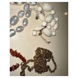 Collection of Vintage Jewelry Including Necklaces, Bracelets, and Pins