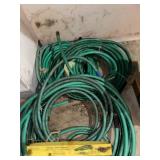 Collection of Garden Hoses with Adjustable Nozzle Sprayer and Sprinkler Stands