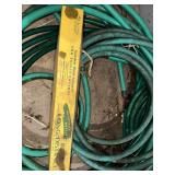 Collection of Garden Hoses with Adjustable Nozzle Sprayer and Sprinkler Stands