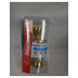 Kwikset Tylo Polished Brass Bed/Bath Door Knob Featuring Microban Antimicrobial Technology with Lock