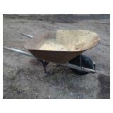 Used Metal Wheelbarrow with Single Wheel and Wooden Handles