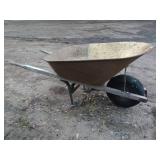 Used Metal Wheelbarrow with Single Wheel and Wooden Handles
