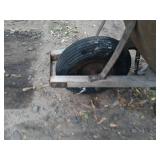 Used Metal Wheelbarrow with Single Wheel and Wooden Handles