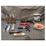 Collection of Caulking Guns and Sealant Tubes