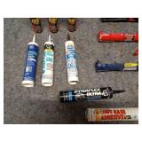 Collection of Caulking Guns and Sealant Tubes