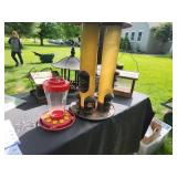 Collection of Bird Feeders Including Two Birdhouses and Two Tube Feeders