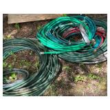 Collection of Garden Hoses in Various Lengths and Colors
