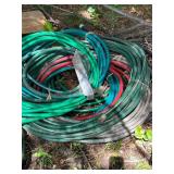 Collection of Garden Hoses in Various Lengths and Colors