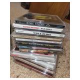 Assorted Collection of Music CDs Including Taylor Swift and John Denver