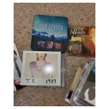 Assorted Collection of Music CDs Including Taylor Swift and John Denver