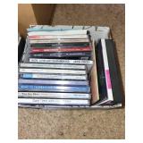 Extensive Collection of Music CDs and DVDs with Storage Cases