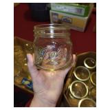 Collection of 34 Assorted Kerr and Ball Mason Jars with Lids