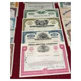 Collection of Vintage Stock Certificates from Various Companies