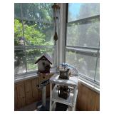 Collection of Rustic Garden Decor Including Birdhouses, Wind Chimes, and Signs