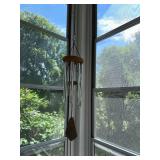 Collection of Rustic Garden Decor Including Birdhouses, Wind Chimes, and Signs