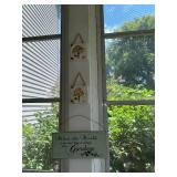 Collection of Rustic Garden Decor Including Birdhouses, Wind Chimes, and Signs
