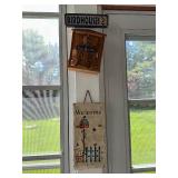 Collection of Rustic Garden Decor Including Birdhouses, Wind Chimes, and Signs