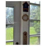 Collection of Rustic Garden Decor Including Birdhouses, Wind Chimes, and Signs