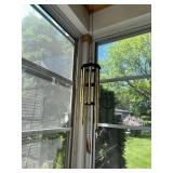 Collection of Rustic Garden Decor Including Birdhouses, Wind Chimes, and Signs