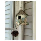 Collection of Rustic Garden Decor Including Birdhouses, Wind Chimes, and Signs