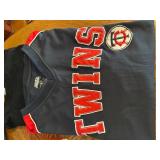 Collection of Minnesota Twins Memorabilia Including Apparel and Statues