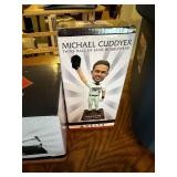 Collection of Minnesota Twins Memorabilia Including Apparel and Statues