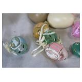 Assorted Easter Decorations Including Snowbunnies, Painted Eggs, and Plush Figures