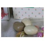 Assorted Easter Decorations Including Snowbunnies, Painted Eggs, and Plush Figures