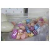 Assorted Easter Decorations Including Snowbunnies, Painted Eggs, and Plush Figures