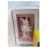 Assorted Easter Decorations Including Snowbunnies, Painted Eggs, and Plush Figures