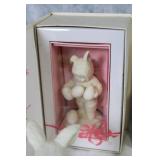 Assorted Easter Decorations Including Snowbunnies, Painted Eggs, and Plush Figures