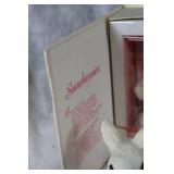 Assorted Easter Decorations Including Snowbunnies, Painted Eggs, and Plush Figures