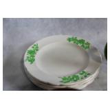 Vintage Kitchenware Collection with Plates, Pitchers, and Lidded Containers