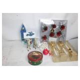 Assorted Holiday Decorations Including Santa Tin, Reindeer Figurines, and Candle Holders