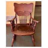 Vintage Oak Rocking Chair with Intricate Back