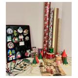 Collection of Holiday Gift Wrapping Supplies Including Wrapping Paper, Gift Bags, and Accessories