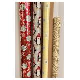 Collection of Holiday Gift Wrapping Supplies Including Wrapping Paper, Gift Bags, and Accessories