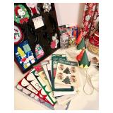 Collection of Holiday Gift Wrapping Supplies Including Wrapping Paper, Gift Bags, and Accessories