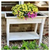White Elevated Outdoor Planter with Blooming Flowers
