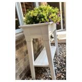 White Elevated Outdoor Planter with Blooming Flowers