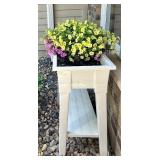 White Elevated Outdoor Planter with Blooming Flowers