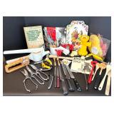Assorted Kitchen Utensils and Tools Featuring Knife Sharpener and Decorative Stencils