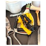 Assorted Kitchen Utensils and Tools Featuring Knife Sharpener and Decorative Stencils