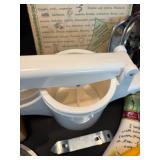 Assorted Kitchen Utensils and Tools Featuring Knife Sharpener and Decorative Stencils