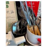 Assorted Kitchen Utensils and Tools Featuring Knife Sharpener and Decorative Stencils