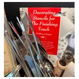 Assorted Kitchen Utensils and Tools Featuring Knife Sharpener and Decorative Stencils