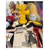 Assorted Kitchen Utensils and Tools Featuring Knife Sharpener and Decorative Stencils
