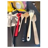 Assorted Kitchen Utensils and Tools Featuring Knife Sharpener and Decorative Stencils