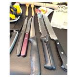 Assorted Kitchen Utensils and Tools Featuring Knife Sharpener and Decorative Stencils