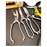 Assorted Kitchen Utensils and Tools Featuring Knife Sharpener and Decorative Stencils